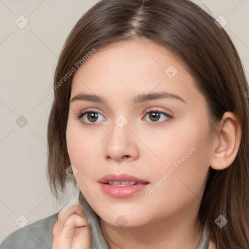 Neutral white young-adult female with long  brown hair and brown eyes