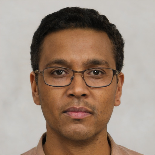Neutral black young-adult male with short  brown hair and brown eyes