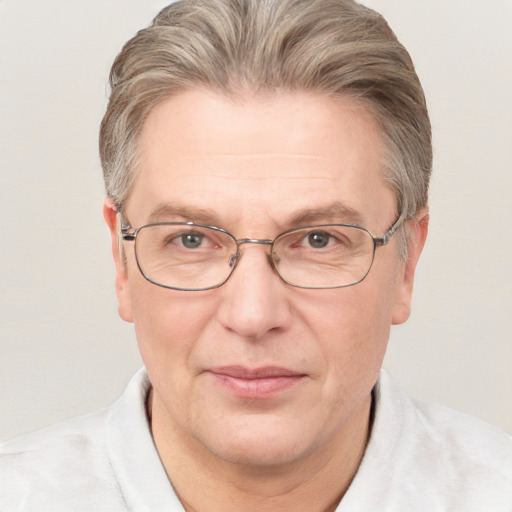 Joyful white middle-aged male with short  brown hair and blue eyes