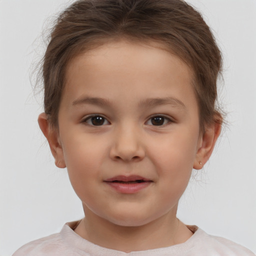 Joyful white child female with short  brown hair and brown eyes