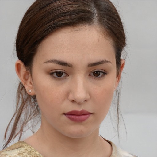 Neutral white young-adult female with medium  brown hair and brown eyes