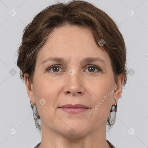 Joyful white adult female with medium  brown hair and grey eyes