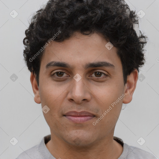 Joyful latino young-adult male with short  brown hair and brown eyes