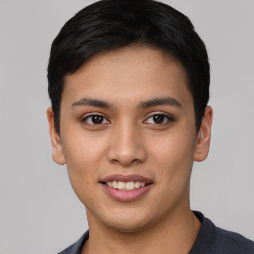 Joyful asian young-adult female with short  black hair and brown eyes