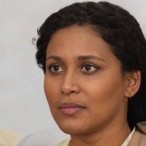 Neutral black young-adult female with short  brown hair and brown eyes