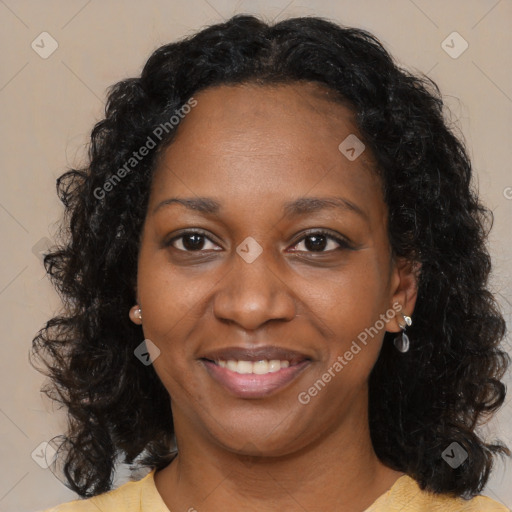 Joyful black adult female with medium  brown hair and brown eyes