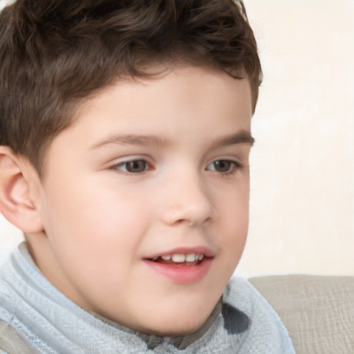 Joyful white child male with short  brown hair and brown eyes