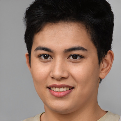 Joyful asian young-adult male with short  brown hair and brown eyes