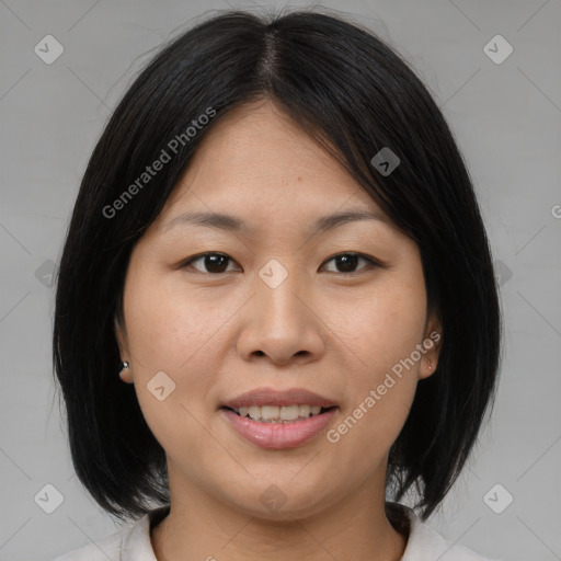 Joyful asian young-adult female with medium  brown hair and brown eyes