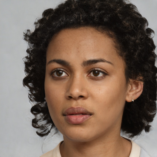 Neutral black young-adult female with medium  black hair and brown eyes