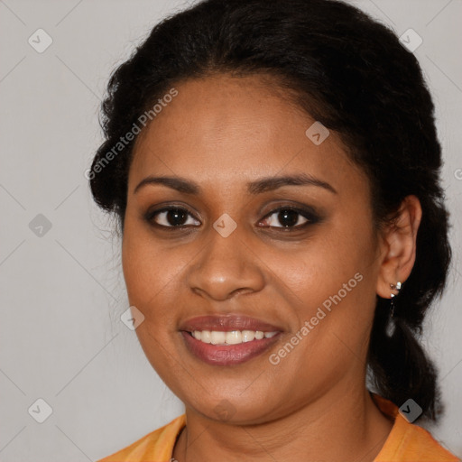 Joyful black young-adult female with long  brown hair and brown eyes