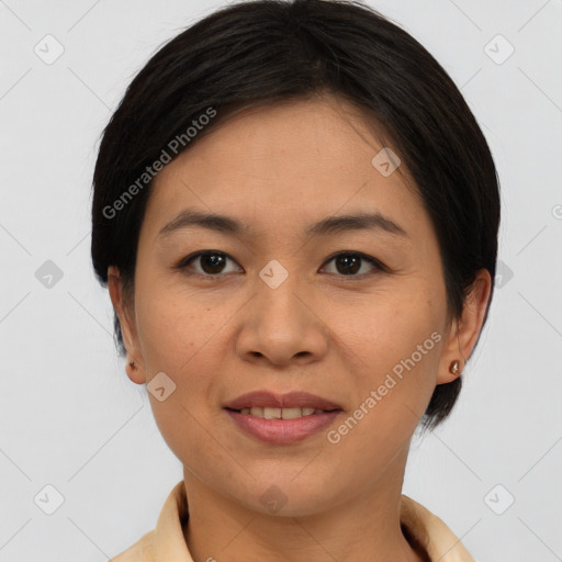 Joyful asian young-adult female with short  brown hair and brown eyes