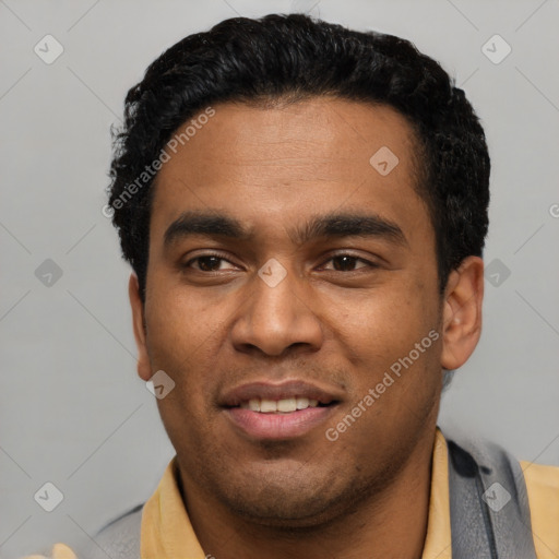Joyful latino young-adult male with short  black hair and brown eyes