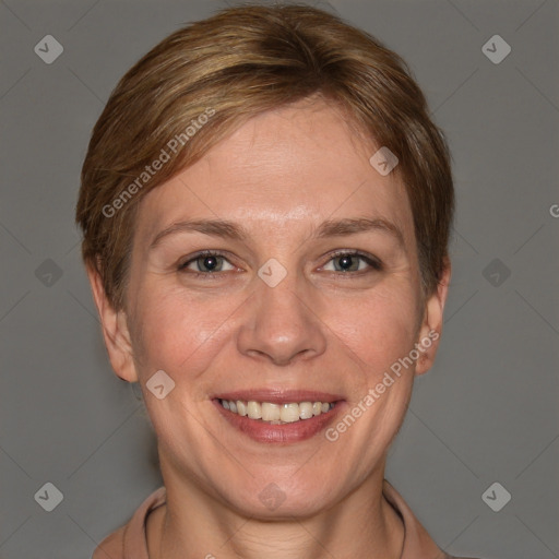 Joyful white adult female with short  brown hair and grey eyes