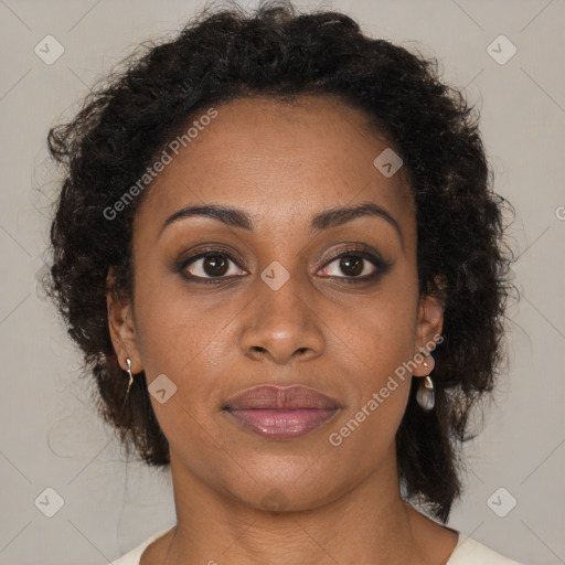 Joyful black young-adult female with medium  brown hair and brown eyes