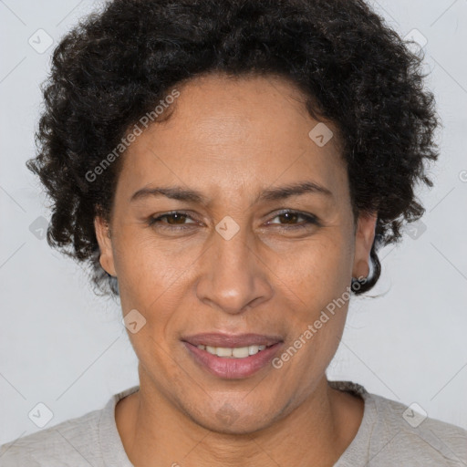 Joyful latino adult female with short  brown hair and brown eyes