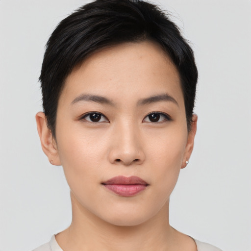 Joyful asian young-adult female with short  black hair and brown eyes