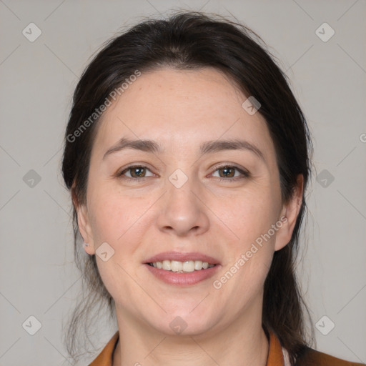 Joyful white adult female with medium  brown hair and brown eyes