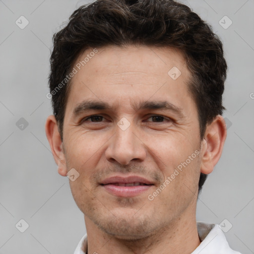 Joyful white adult male with short  brown hair and brown eyes