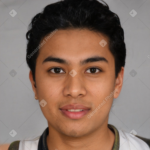 Joyful latino young-adult male with short  black hair and brown eyes
