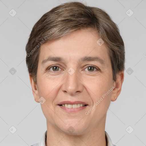 Joyful white adult female with short  brown hair and brown eyes