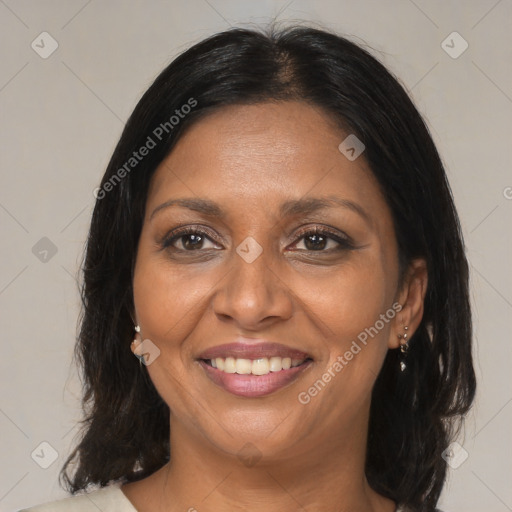 Joyful asian adult female with medium  brown hair and brown eyes