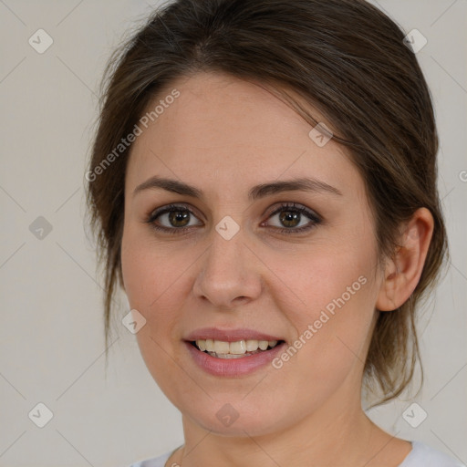 Joyful white young-adult female with medium  brown hair and green eyes