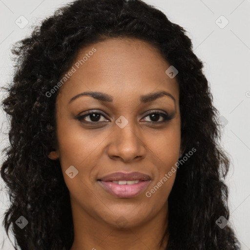 Joyful black young-adult female with long  brown hair and brown eyes