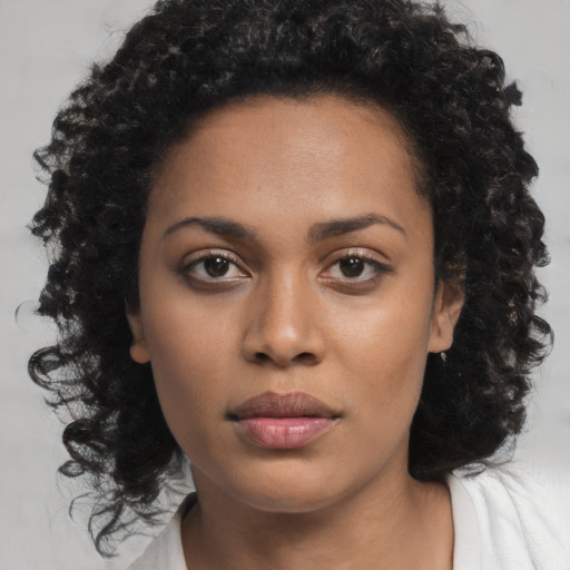 Neutral black young-adult female with long  brown hair and brown eyes