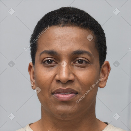 Joyful black young-adult male with short  black hair and brown eyes