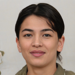 Joyful asian young-adult female with medium  brown hair and brown eyes