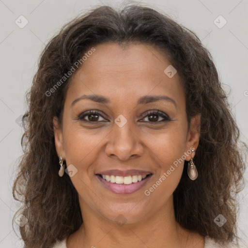 Joyful black adult female with medium  brown hair and brown eyes