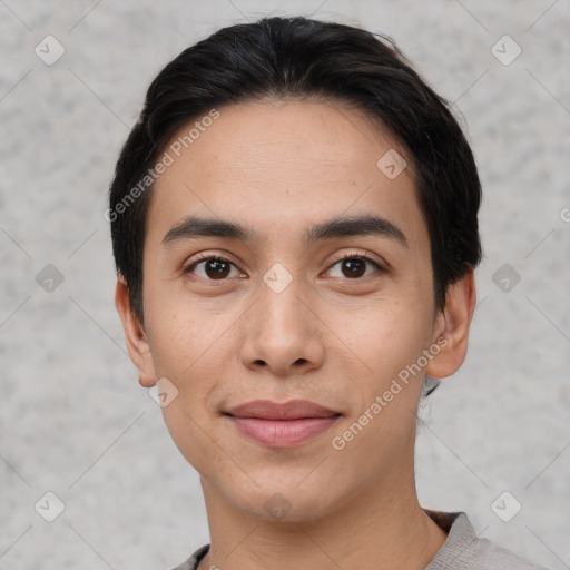 Joyful white young-adult male with short  black hair and brown eyes