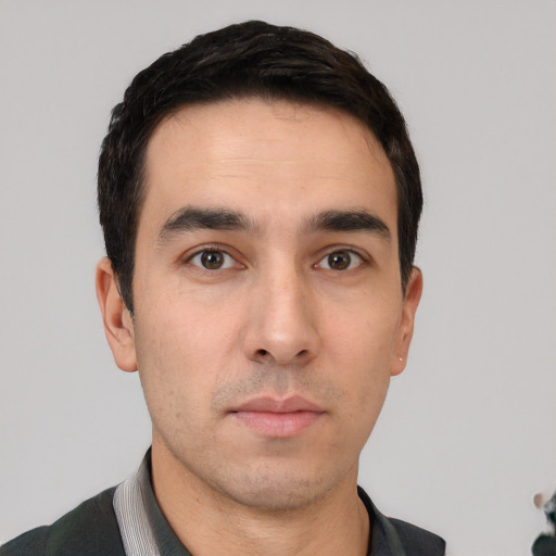 Neutral white young-adult male with short  black hair and brown eyes