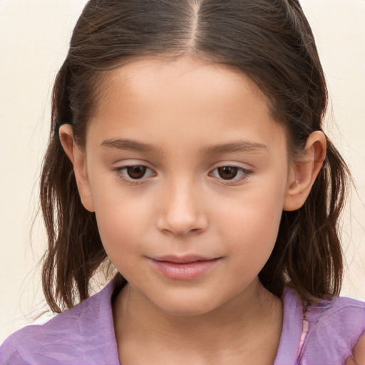 Joyful white child female with long  brown hair and brown eyes