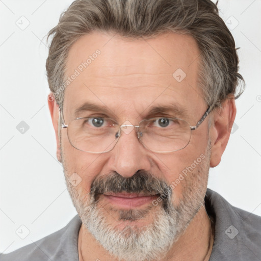 Joyful white middle-aged male with short  gray hair and brown eyes