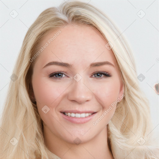 Joyful white young-adult female with long  brown hair and blue eyes