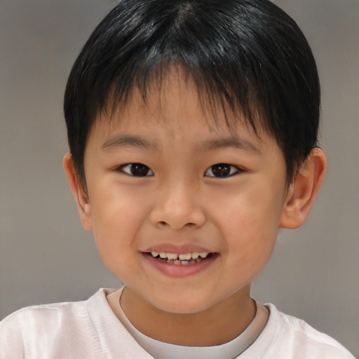 Joyful asian child male with short  brown hair and brown eyes