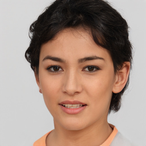 Joyful asian young-adult female with short  brown hair and brown eyes