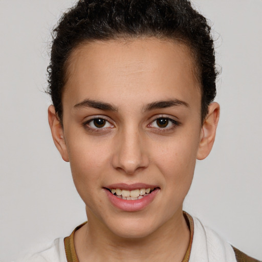 Joyful white young-adult female with short  brown hair and brown eyes