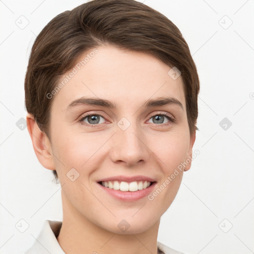 Joyful white young-adult female with short  brown hair and grey eyes