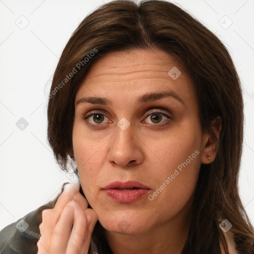 Joyful white adult female with long  brown hair and brown eyes