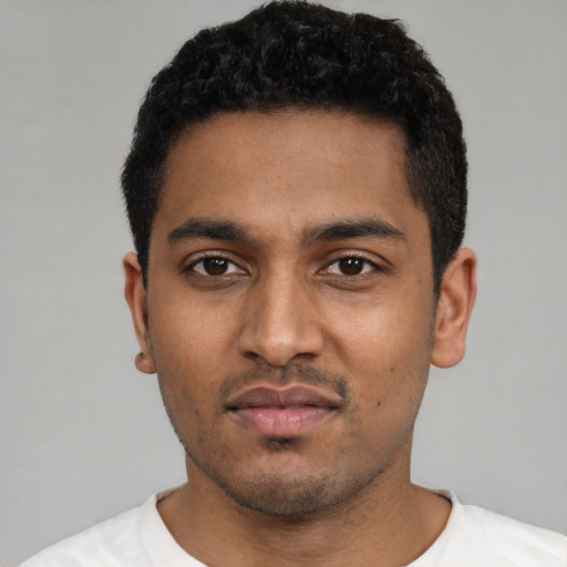 Neutral black young-adult male with short  black hair and brown eyes