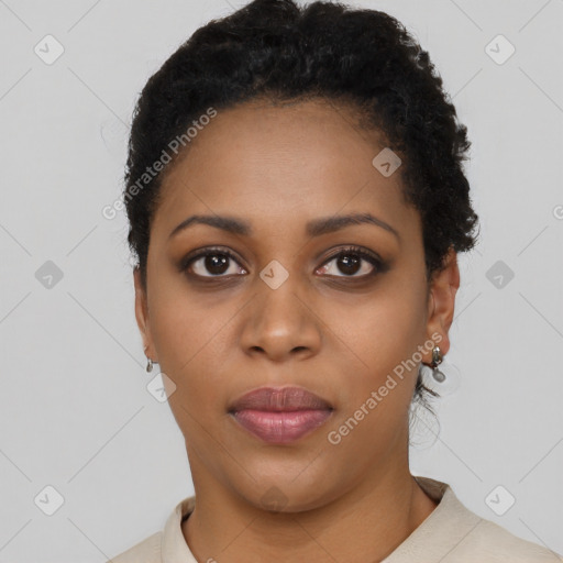 Joyful black young-adult female with short  black hair and brown eyes