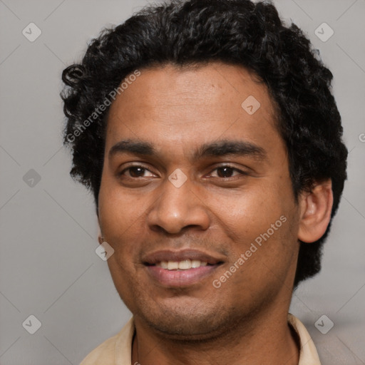 Joyful latino young-adult male with short  brown hair and brown eyes