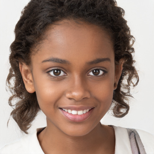 Joyful black child female with medium  brown hair and brown eyes