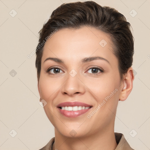 Joyful white young-adult female with short  brown hair and brown eyes