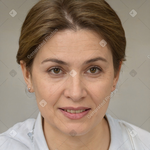 Joyful white adult female with medium  brown hair and brown eyes