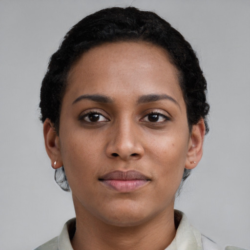 Neutral latino young-adult female with short  brown hair and brown eyes