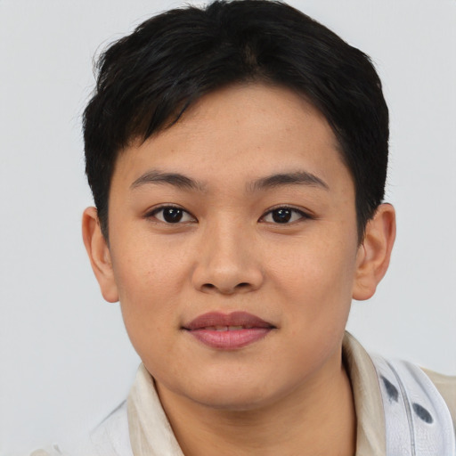 Joyful asian young-adult female with short  brown hair and brown eyes